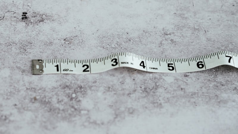 measuring violin size with tape measure