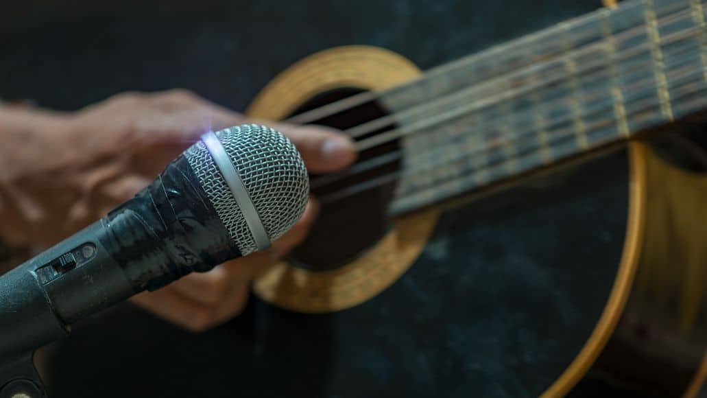 Microphone recording an acoustic guitar