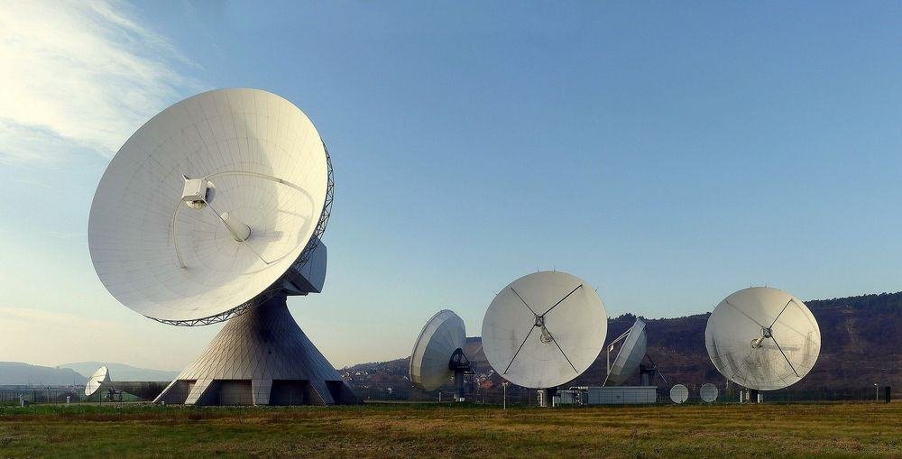 Radio dishes creating electromagnetic waves