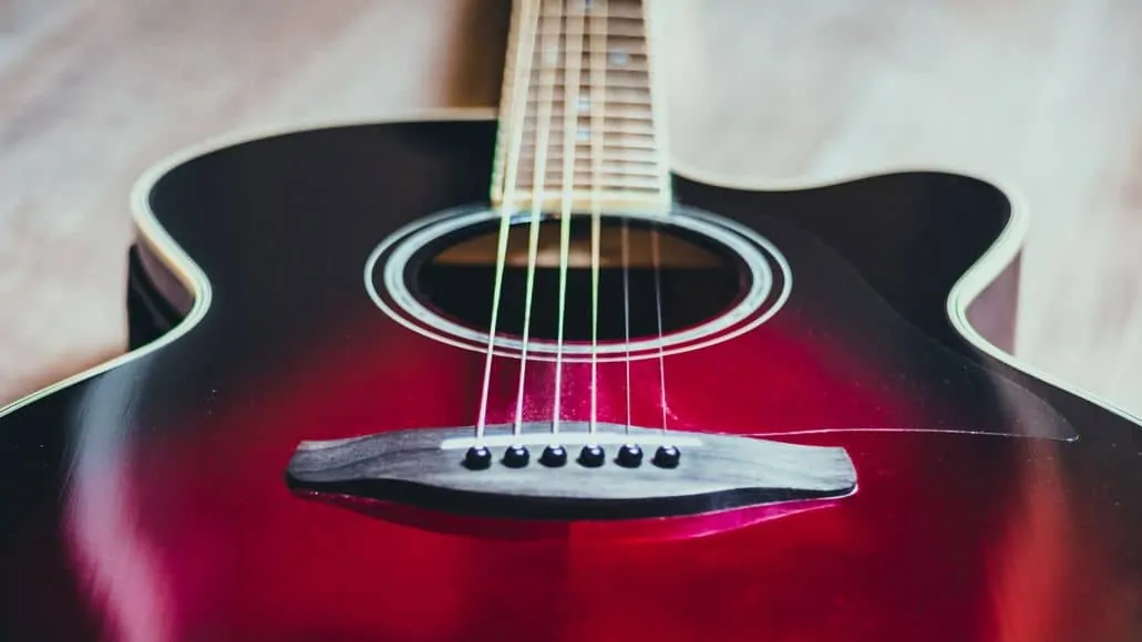 Acoustic guitar with bridge pins