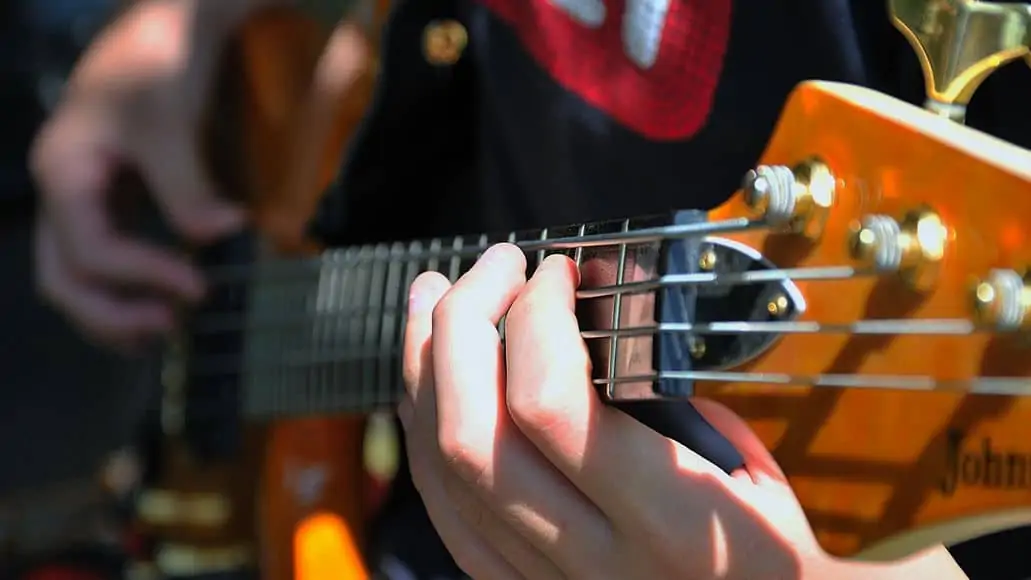 bass guitar action can cause buzzing