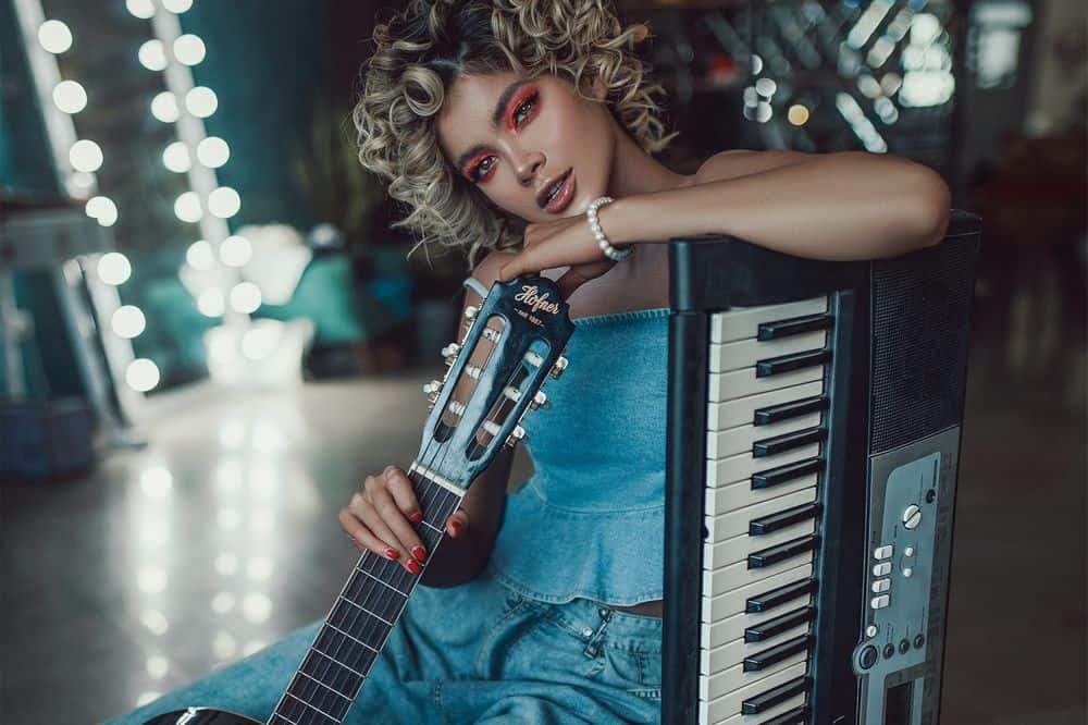 woman with long nails -and guitar