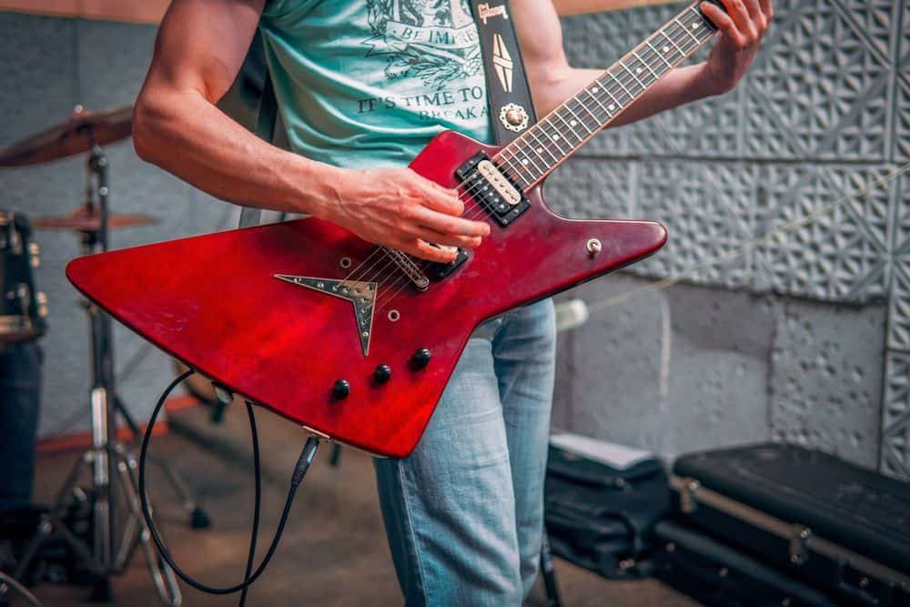 man playing electric guitar