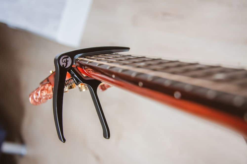 guitar capo lamped on neck